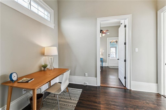 office with a ceiling fan, baseboards, and wood finished floors