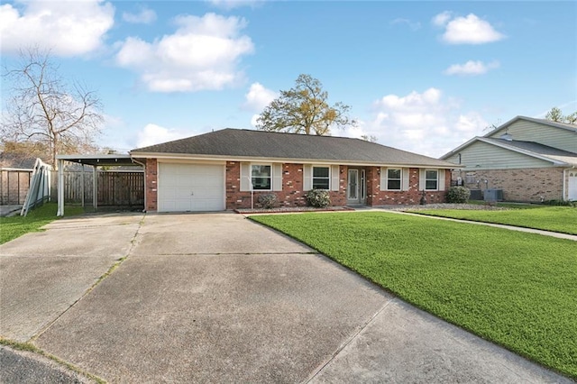 ranch-style house featuring a front lawn, a carport, fence, concrete driveway, and brick siding