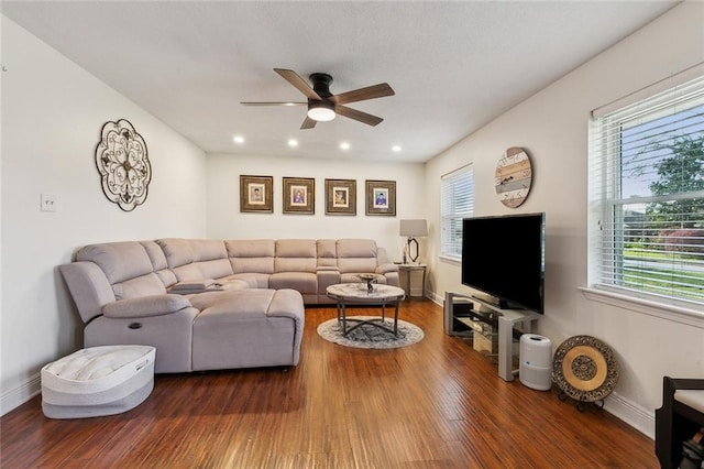 living area featuring recessed lighting, wood finished floors, baseboards, and ceiling fan