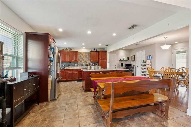 dining space with light tile patterned flooring, recessed lighting, and visible vents