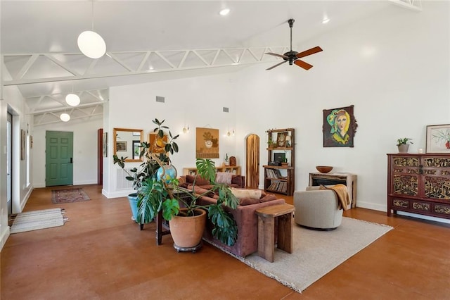 living area with visible vents, a ceiling fan, baseboards, and high vaulted ceiling