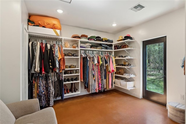 spacious closet featuring visible vents