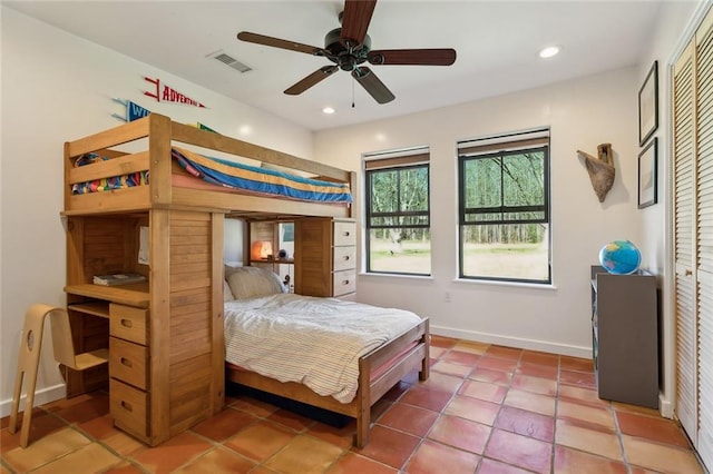 bedroom featuring tile patterned floors, recessed lighting, visible vents, and baseboards