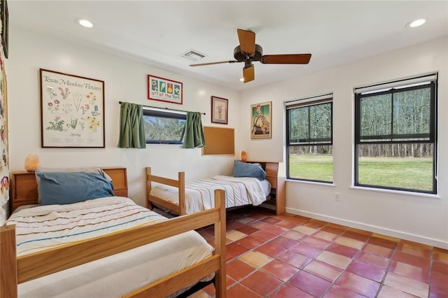 bedroom with recessed lighting, baseboards, and tile patterned flooring