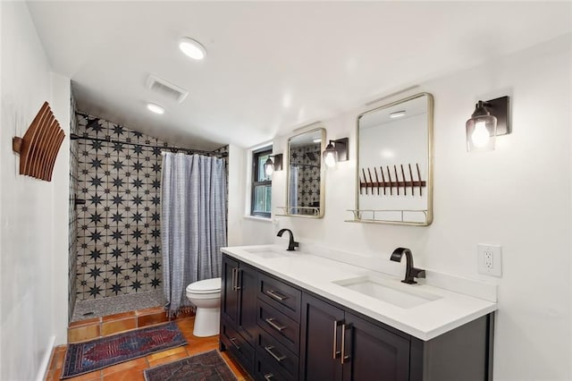 full bath featuring a shower stall, toilet, and a sink