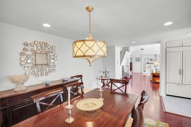 dining space featuring stairway, recessed lighting, and wood finished floors