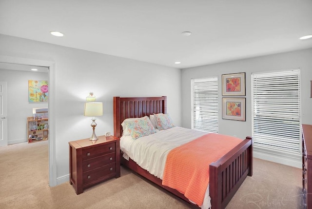 bedroom with recessed lighting, baseboards, and light colored carpet