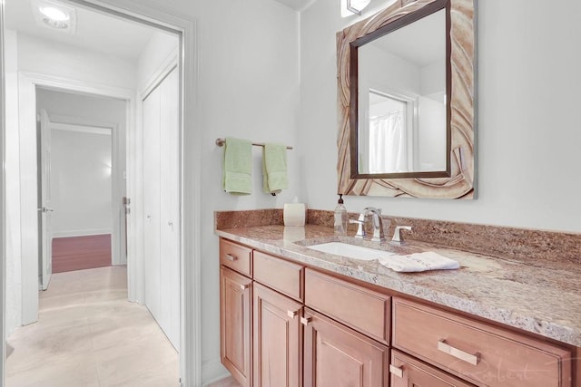 bathroom featuring vanity and tile patterned flooring