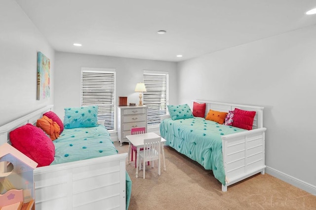 carpeted bedroom featuring recessed lighting and baseboards