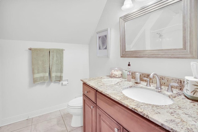 bathroom featuring vanity, baseboards, lofted ceiling, tile patterned flooring, and toilet