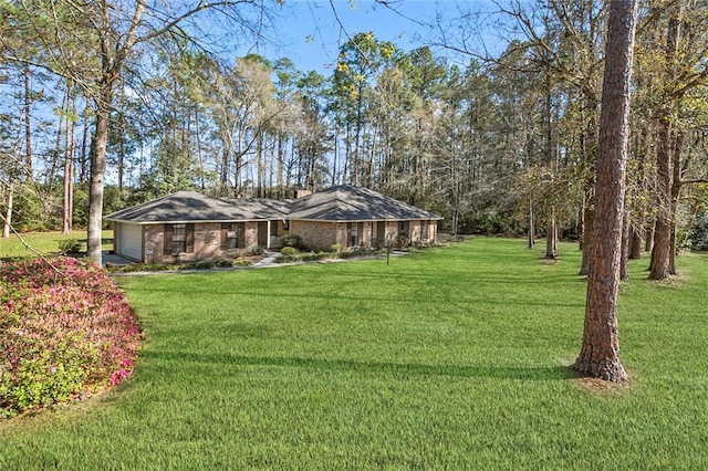 view of yard featuring an attached garage