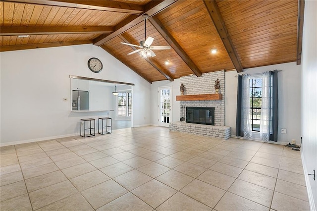 unfurnished living room with beam ceiling, high vaulted ceiling, a ceiling fan, light tile patterned floors, and wood ceiling