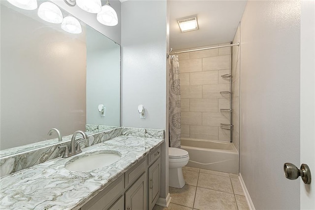 full bathroom featuring tile patterned flooring, baseboards, toilet, vanity, and shower / bathtub combination with curtain