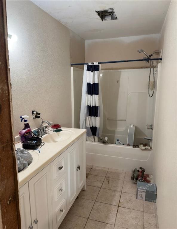 full bath with tile patterned flooring, vanity, and shower / bathtub combination with curtain