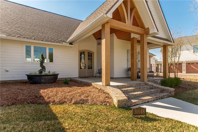 property entrance with french doors and roof with shingles