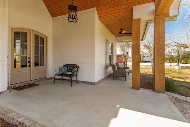 view of patio featuring a ceiling fan and french doors