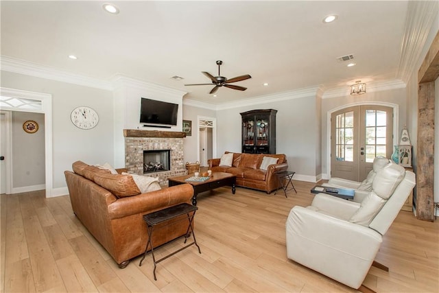 living area with light wood finished floors and ornamental molding