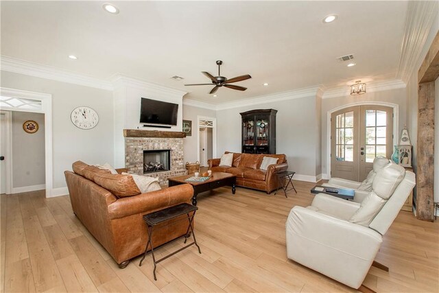 30648 Carter Cemetery Rd, Springfield, LA 70462 - living area featuring visible vents, ceiling fan, crown molding, and light wood finished floors