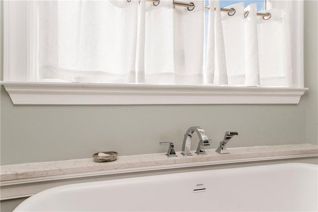 bathroom with a sink and plenty of natural light