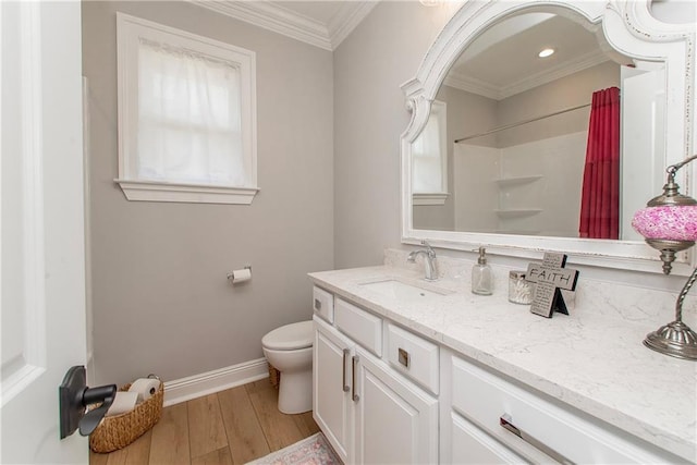 full bath featuring crown molding, toilet, wood finished floors, plenty of natural light, and vanity