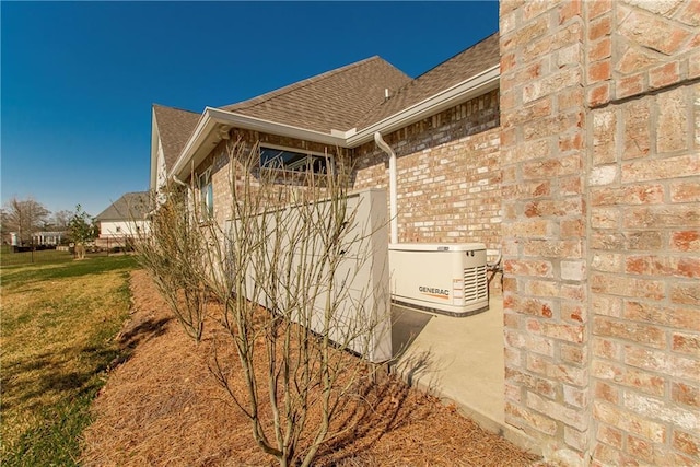 30648 Carter Cemetery Rd, Springfield, LA 70462 - view of side of property featuring brick siding, a yard, and roof with shingles