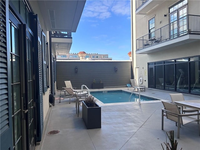 pool with a patio