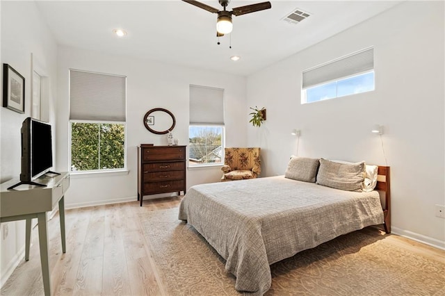 bedroom featuring visible vents, recessed lighting, light wood-type flooring, and baseboards