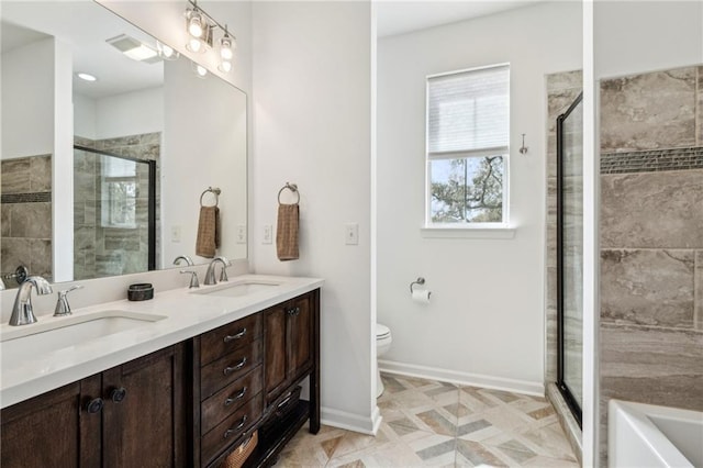 full bathroom featuring a shower stall and a sink