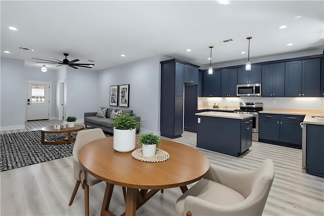 interior space with visible vents, baseboards, recessed lighting, light wood-style floors, and ceiling fan