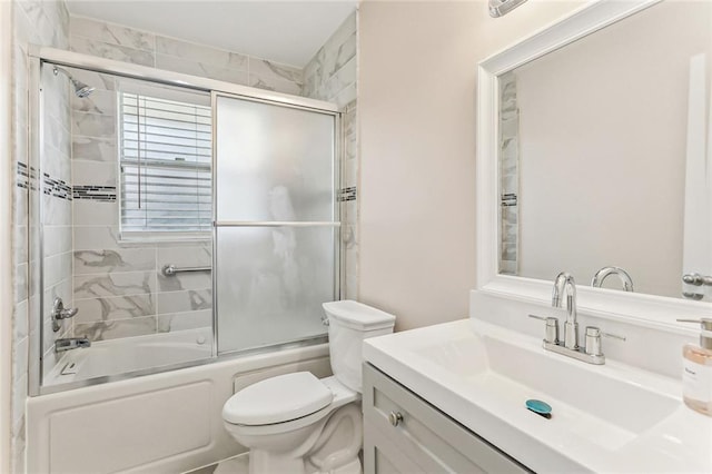 full bath featuring vanity, toilet, and enclosed tub / shower combo