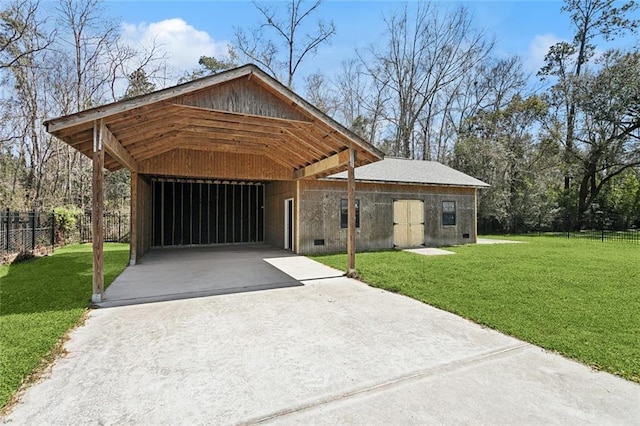 view of front of home with concrete driveway, a front yard, and fence