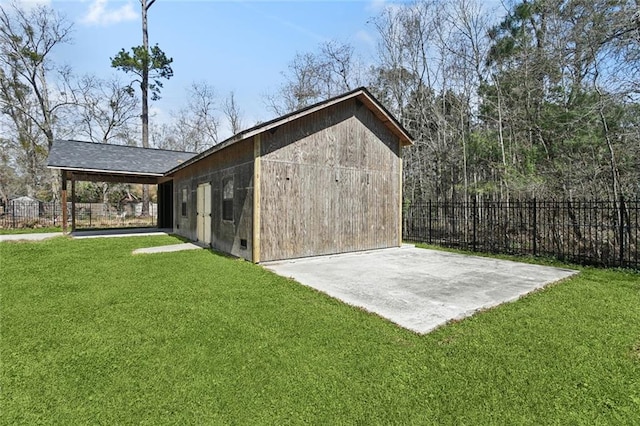 view of outbuilding featuring fence