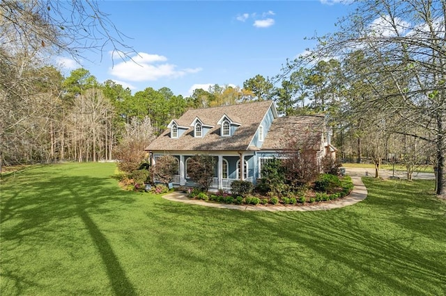 view of front of house with a porch and a front yard