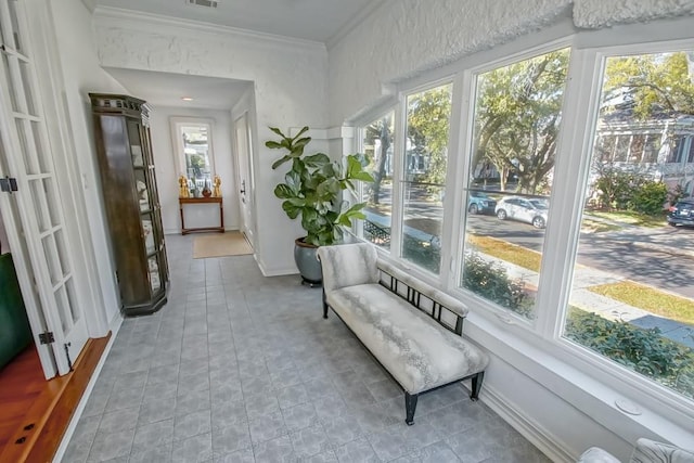 2405 Octavia St, New Orleans, LA 70115 - sunroom / solarium with visible vents, crown molding, and baseboards