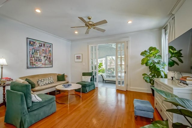 living room with wood finished floors, recessed lighting, a ceiling fan, and ornamental molding