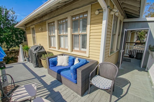 wooden terrace featuring area for grilling