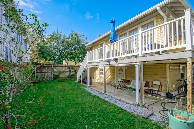 back of house with a patio, stairway, fence, a yard, and a deck