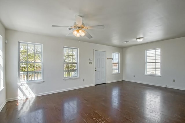 entrance foyer with dark wood-type flooring, a ceiling fan, baseboards, and visible vents