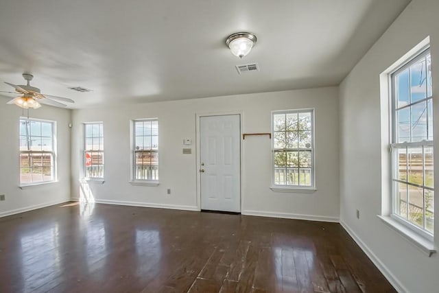 entrance foyer featuring visible vents, baseboards, dark wood-style floors, and a ceiling fan