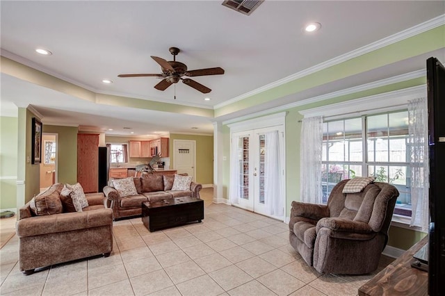 living area featuring visible vents, ornamental molding, a ceiling fan, french doors, and light tile patterned floors