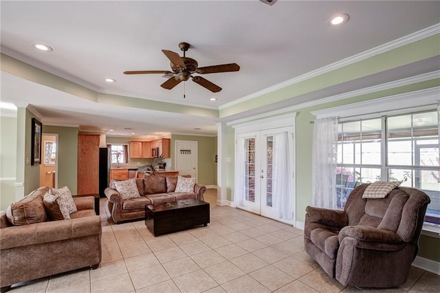 living area with light tile patterned floors, a ceiling fan, recessed lighting, ornamental molding, and french doors