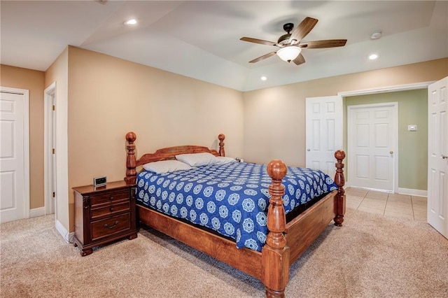 bedroom with recessed lighting, light colored carpet, and baseboards