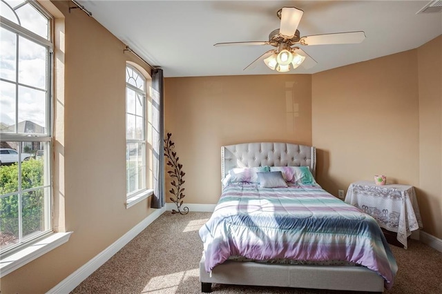 bedroom with visible vents, carpet, and baseboards