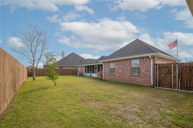 view of yard featuring central AC unit and a fenced backyard