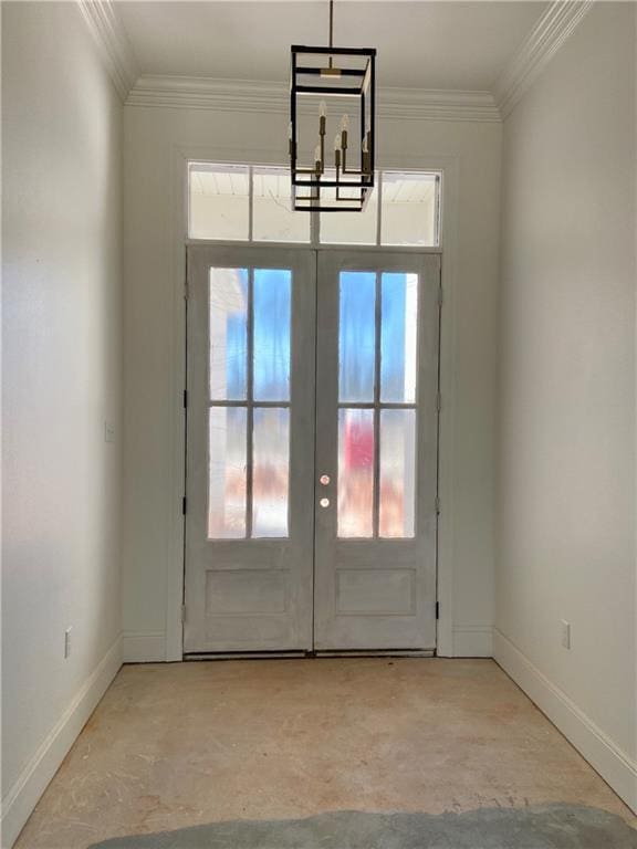 foyer with crown molding, french doors, baseboards, and concrete flooring