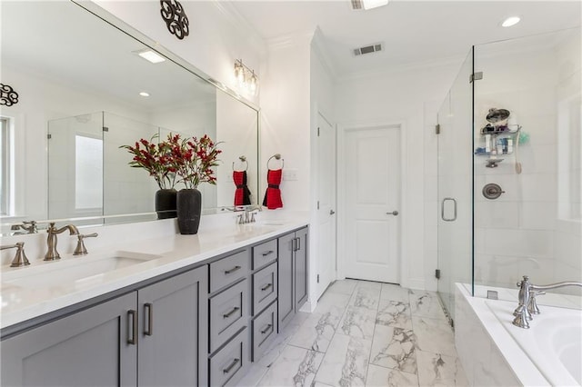 bathroom featuring ornamental molding, a sink, a shower stall, double vanity, and a bath