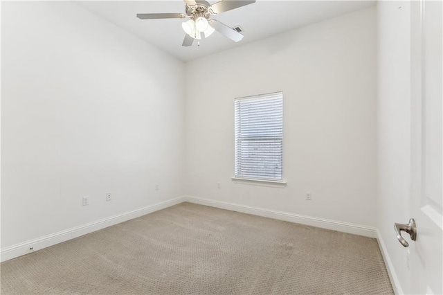 unfurnished room featuring baseboards, light carpet, visible vents, and a ceiling fan