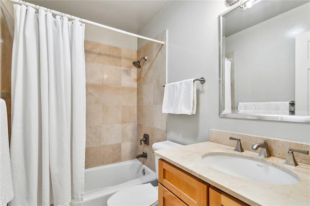 full bathroom featuring shower / bathtub combination with curtain, toilet, and vanity