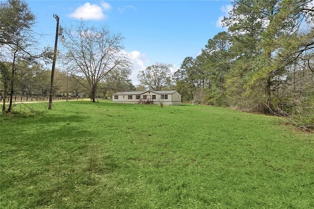 view of yard with a wooden deck