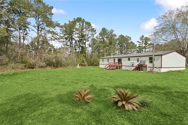 view of yard with a wooden deck